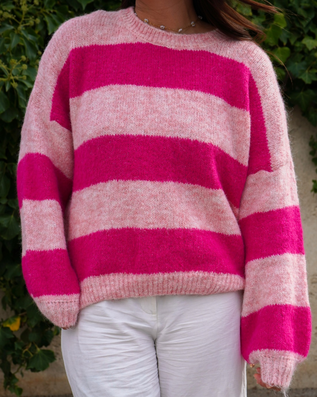 Pull rayures rose défectueux